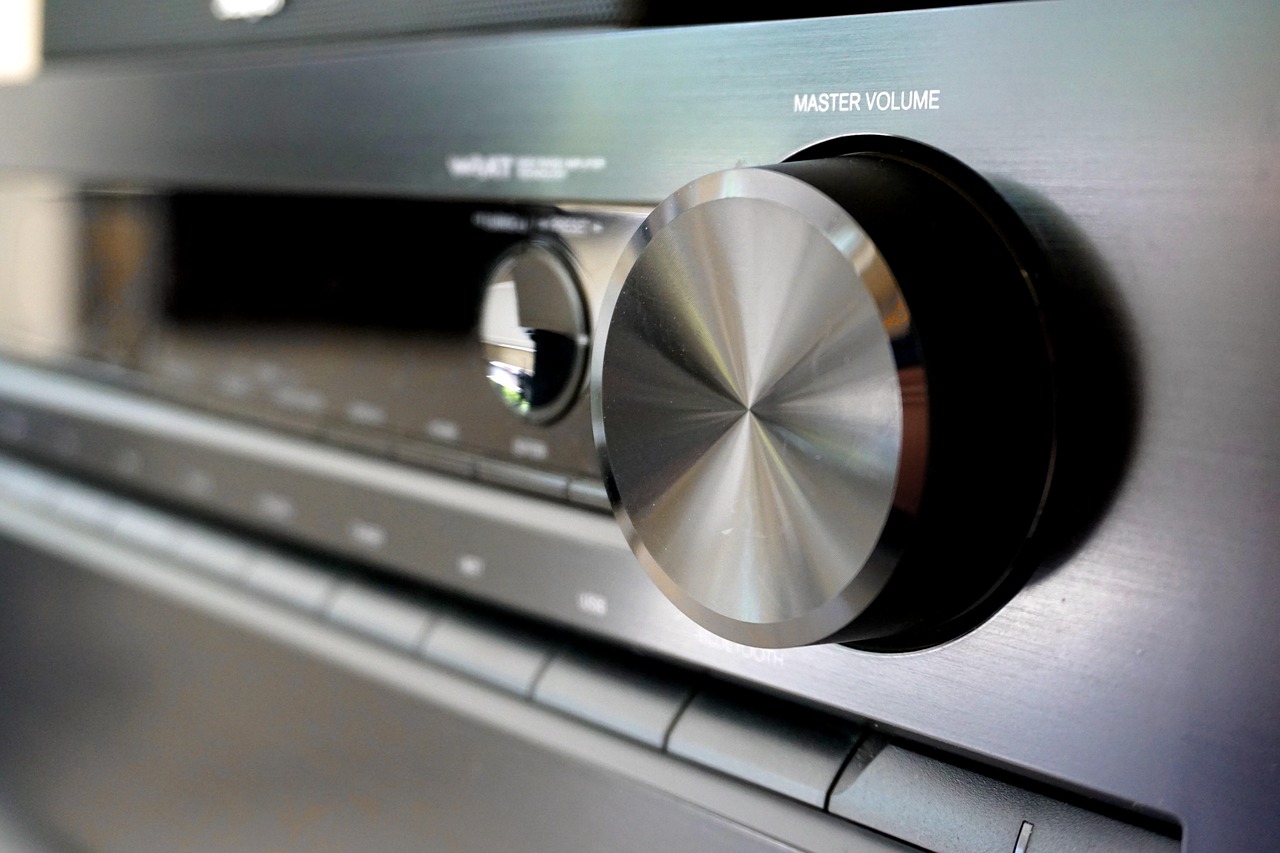 Vintage audio amplifier receiver with master volume knob and illuminated display